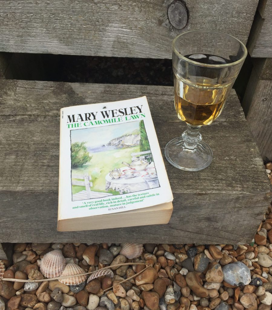 A copy of The Camomile Lawn and a glass of Pimms