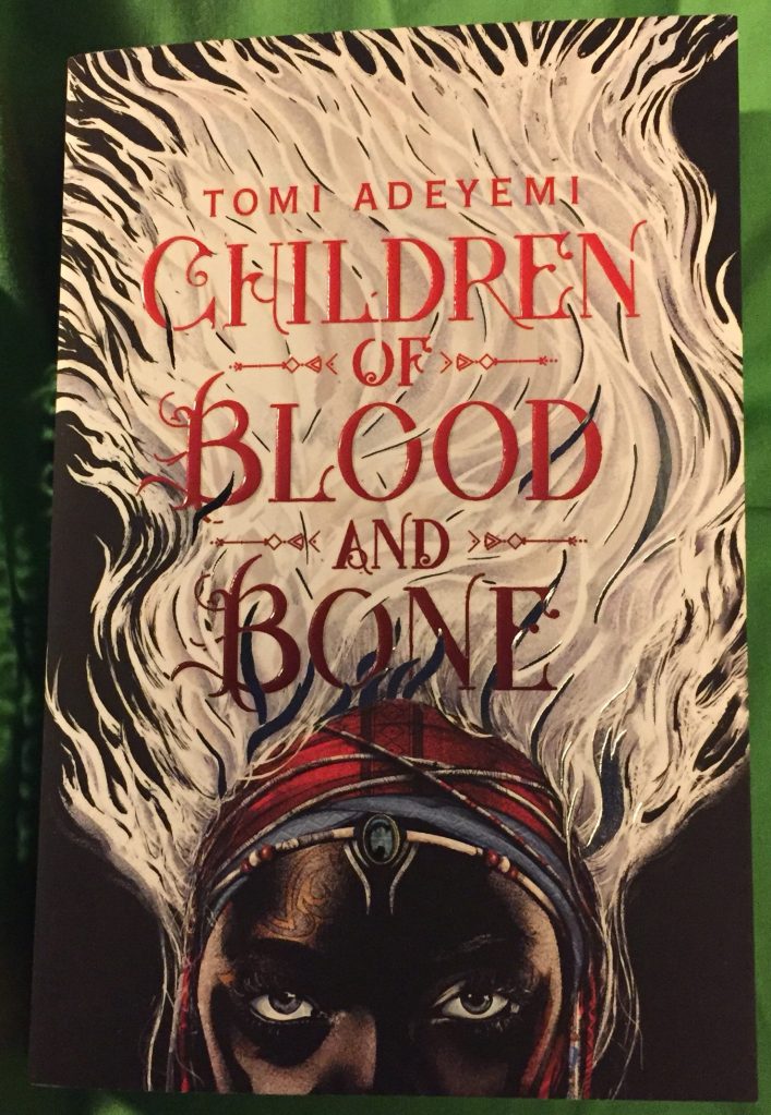Paperback copy of Children of Blood and Bone