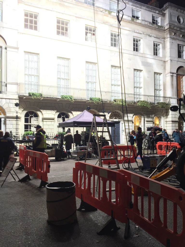 Film crew with powerful lights outside a Georgian town house in Bloomsbury 