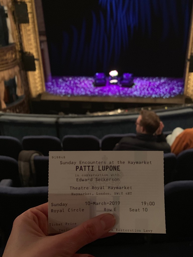 theatre ticket and stage in the background