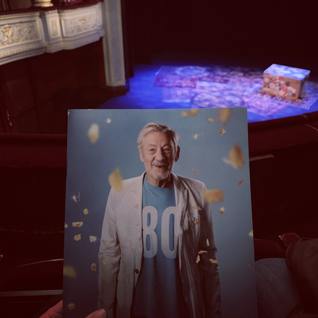 Theatre programme with picture of Sir Ian McKellen with a stage in the background