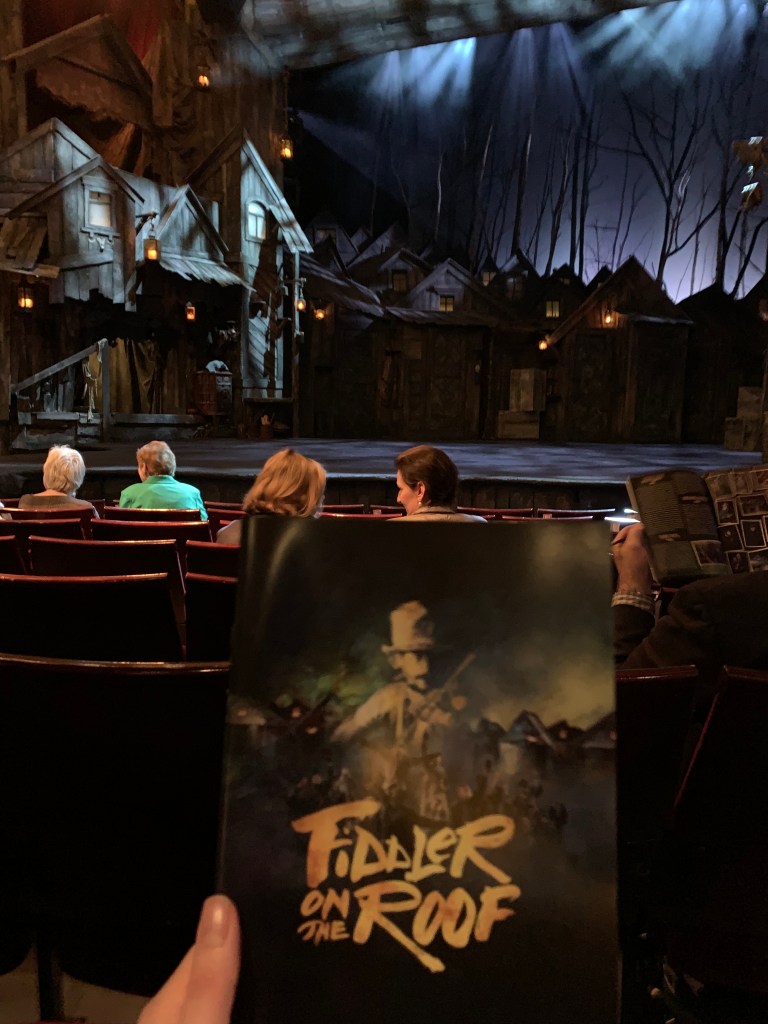 Programme and stage set up of Fiddler on the Roof