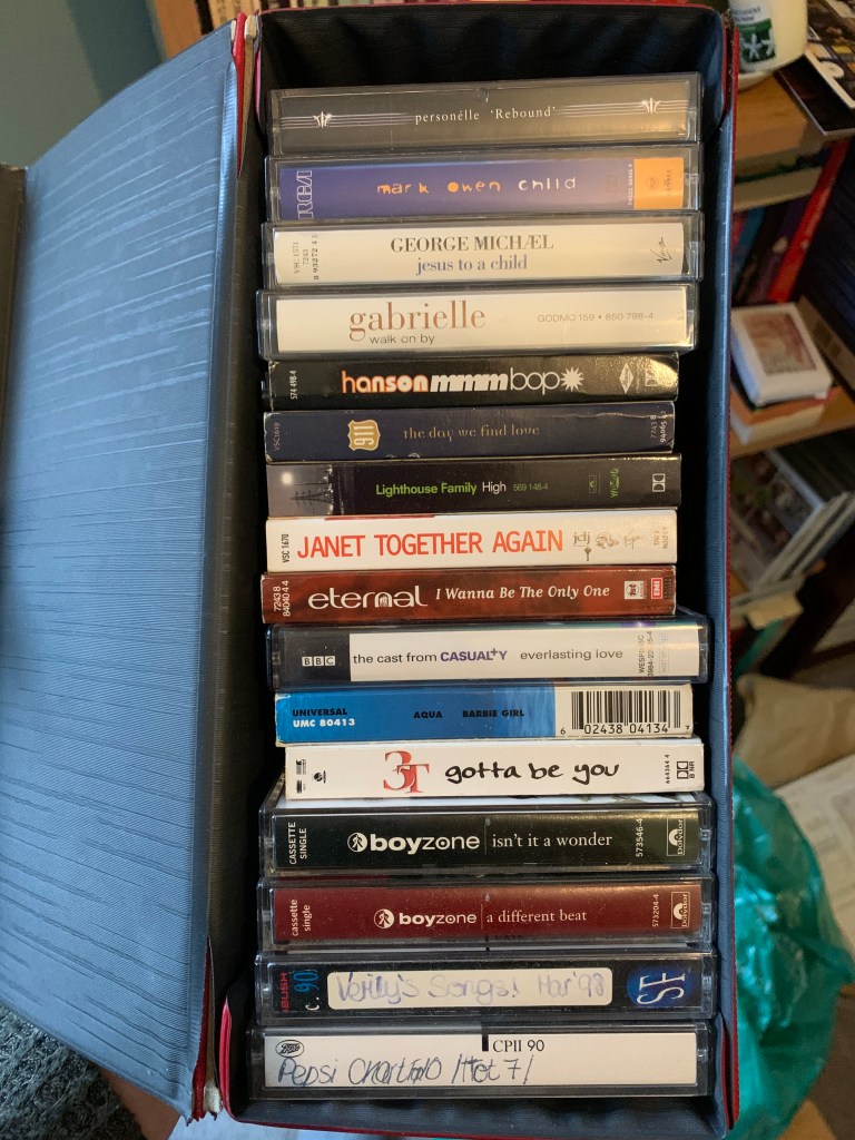 Box full of cassette singles including Hanson, Lighthouse Family, Aqua and Boyzone