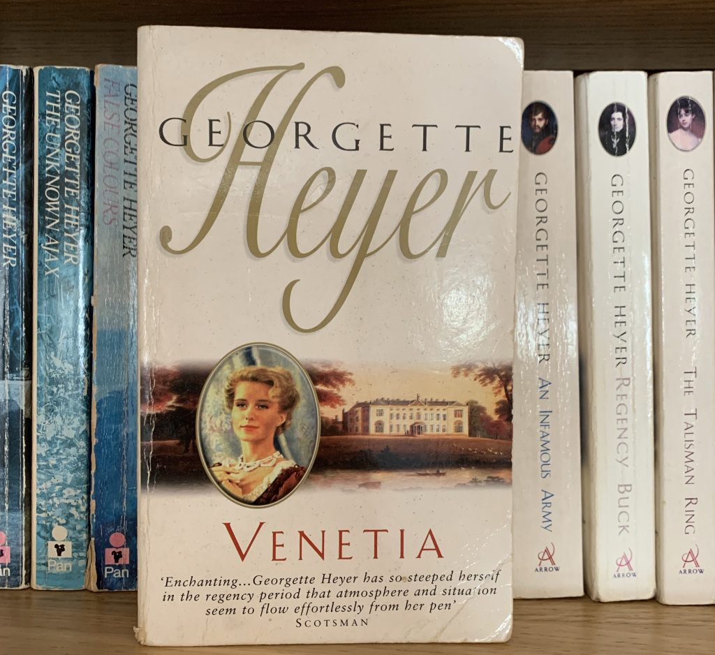 Well-loved copy of Venetia with other Heyer books behind it