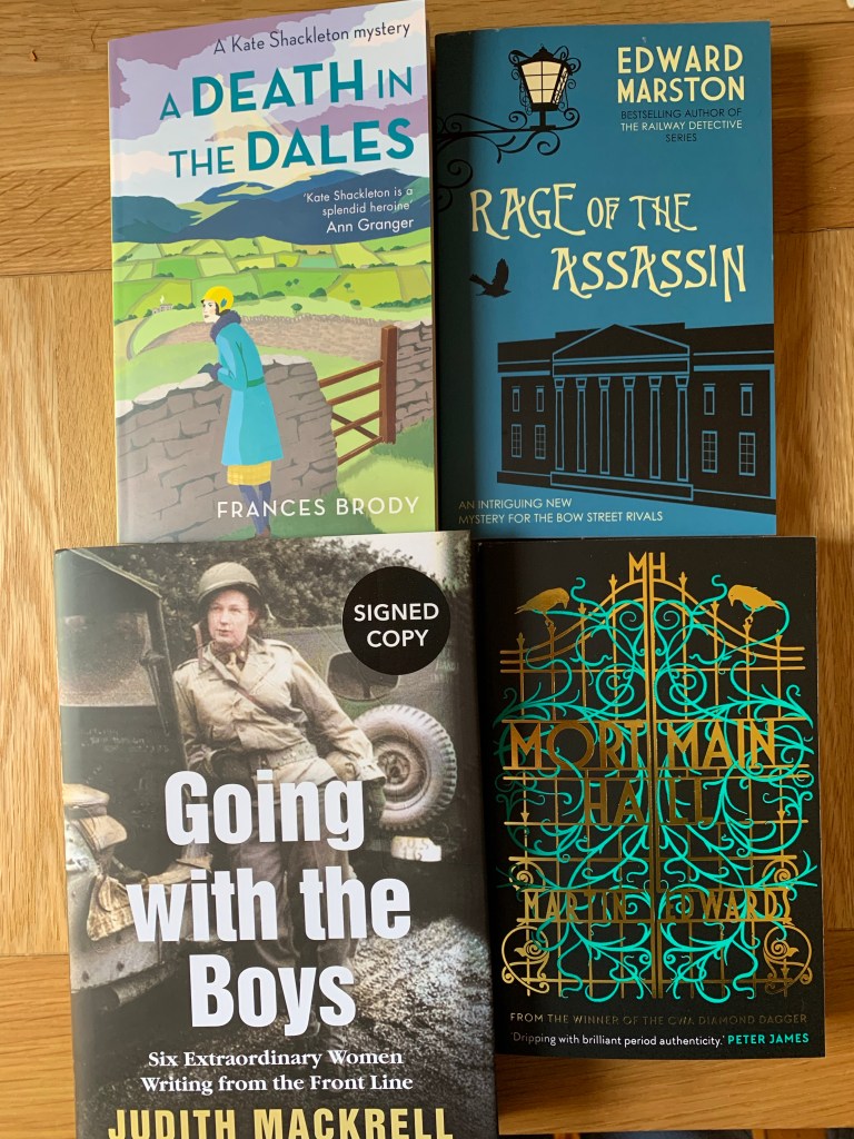 Four books on a desk