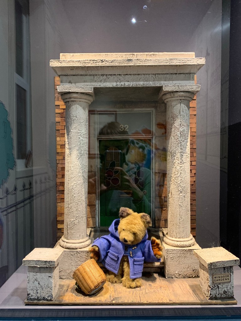 A model Paddington sitting outside the door to Windsor gardens